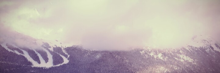 Obraz premium Snow covered mountain during sunset