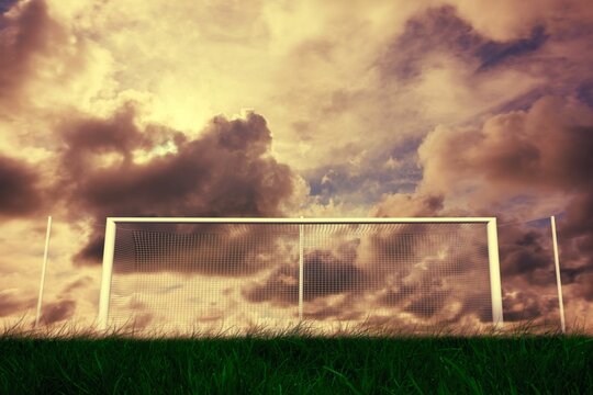 Fototapeta Football goal under cloudy sky
