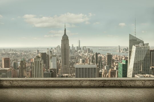 Fototapeta Empire State Building is dominating flat design skyline and concrete parapet, clouds and waterfront