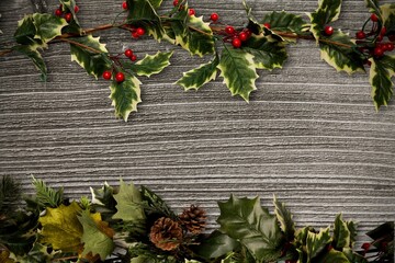 Holly twigs over wooden planks