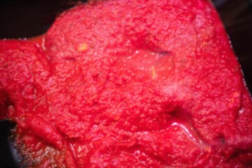 Bright red sauce is being shown in flat design filling pan, with spatula, transparent background