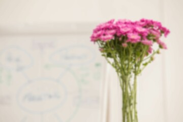 Pink flowers with whiteboard in background