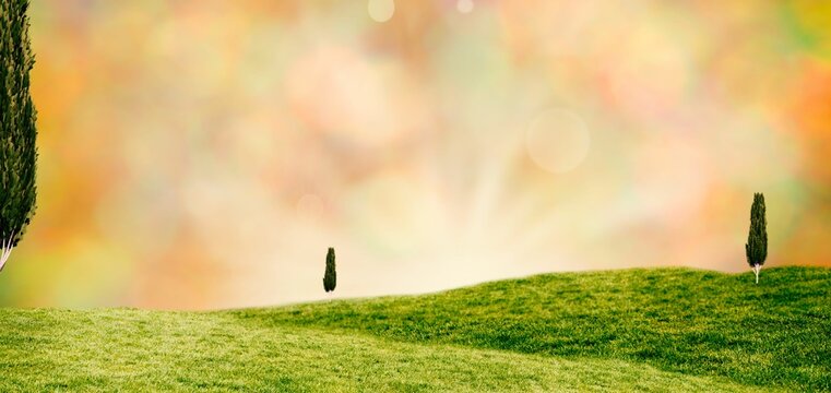 Fototapeta Flat design landscape is showing rolling green hills under pastel bokeh sky with sun rays
