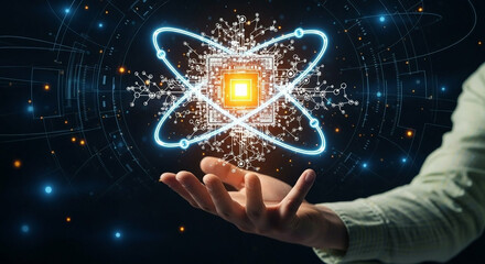 A person's hand hovers over a digital representation of an atom, composed of glowing circuit-board-like elements.