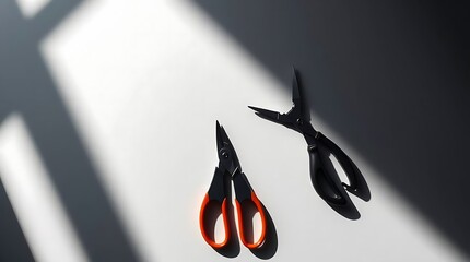 Contemporary still life featuring precision cutting tools in striking light