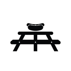 Black silhouette of picnic table with hot dog icon