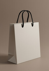 A blank white paper shopping bag with black handles, isolated on a brown background
