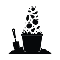 Black silhouette of a bucket overflowing with fruits and a garden trowel in soil