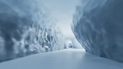 A cool, icy tunnel with textured, flowing ice formations.
