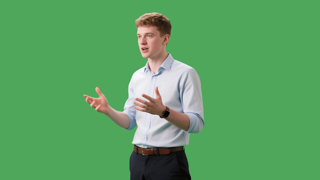 Young man in a white shirt confidently explaining a topic on a green screen