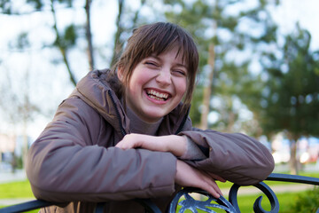portrait of a teenage girl in a spring park