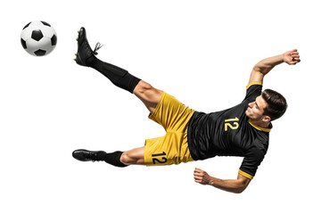 Male football player performing bicycle kick in black and yellow uniform, isolated on transparent background