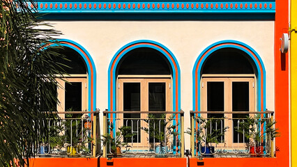 Building facade with decorative windows and balconies in the tourist area. Suitable for...