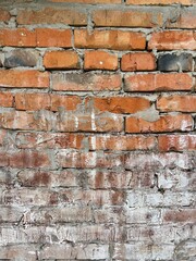 old brick wall stained with paint