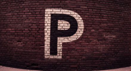 Painted Parking Symbol On A Weathered Brick Wall Urban Aesthetic Photography