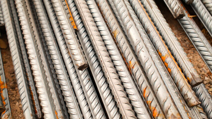 Steel reinforcement for concrete reinforcement. Pile of steel rebars stacked on a construction site