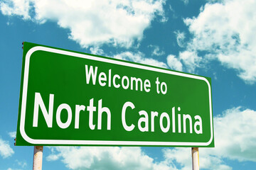 Welcome To North Carolina Green Road Sign at the entrance to the state.
