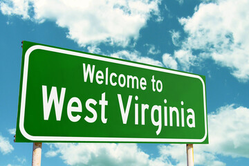Welcome To West Virginia Green Road Sign at the entrance to the state.