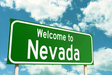 Welcome To Nevada Green Road Sign at the entrance to the state.
