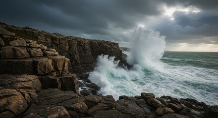 Dramatic coastal landscape featuring powerful waves crashing against rocky cliffs under a cloudy sky