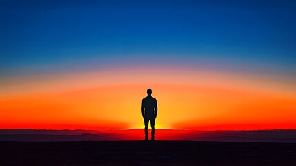 Silhouette of a person against a vibrant sunset horizon.