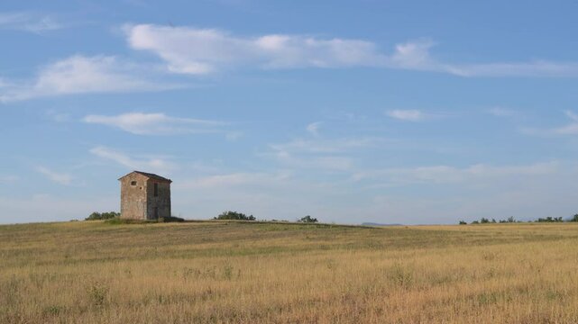 Beautiful Stone Hut on Empty Farm Land Blue Sky Rural Country. Southern France Crop Agriculture Plains Grass Hill Yellow Wheat