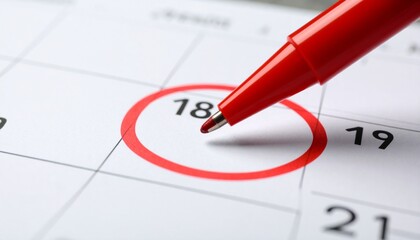 Fototapeta premium Mark Your Calendar Close-up of a Date Circled with a Red Pen for Reminders and Appointments