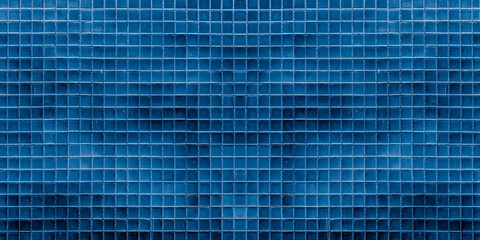 Dark blue ceramic tile wall for abstract seamless background and texture.