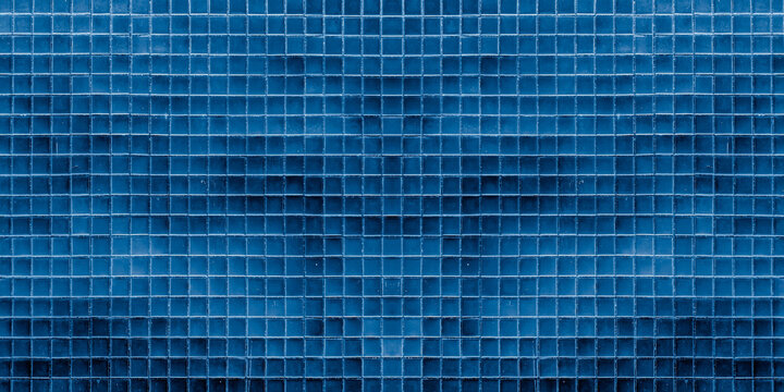 Dark blue ceramic tile wall for abstract seamless background and texture.