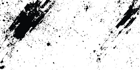 Abstract ink splatter background with black and white textures. A dynamic and chaotic effect, movement with different sizes of spots, splashes, drips, drops and smudges. Isolated on white background. 
