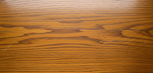 Close up shot of a brown wooden surface with a visible grain pattern., a great fit for background imagery in fintech apps, technology ads, or elegant site headers