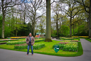 Photo of a man in the Keukenhof flower garden, Netherlands