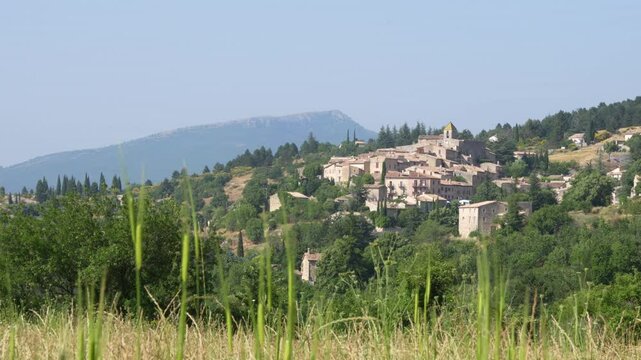 Aurel Village France Grass in Foreground Provence Stone Beautiful Wide on a Hill in the Day. Medieval Church of Saint Aur&egrave;le 12th Century Town.