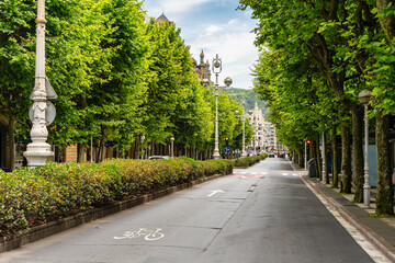 Tree-lined streets with historic buildings in the city centre of San Sebastian, Basque Country.