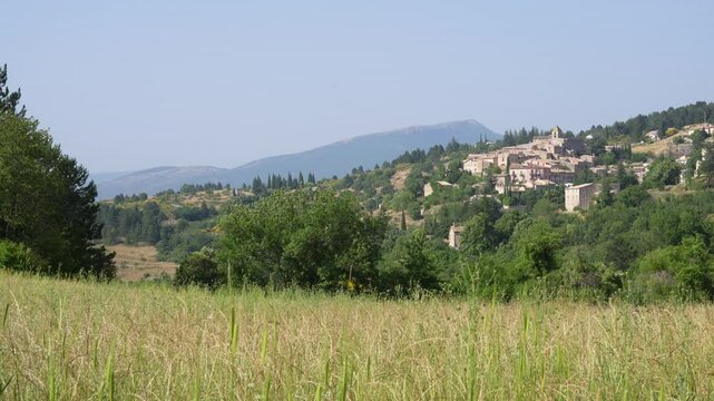 Aurel Village Wide View France Grass in Foreground Provence on a Hill in the Day. Medieval Church of Saint Aur&egrave;le 12th Century Town.