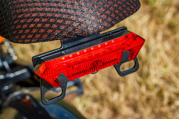 Brake light with red turn signals mounted on the back of an e-bike