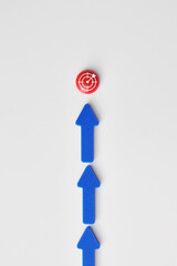 Arrows pointing to a red target, the concept of moving towards a goal