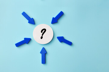Concept of decision making with arrows pointing to a question mark