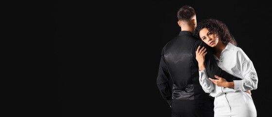 Young couple hugging on black background. Yin Yang concept