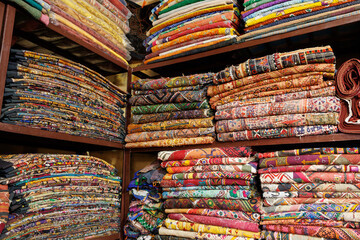 colorful textiles for sale in the textile shop Jaisalmer, India