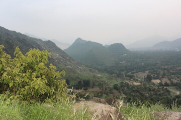 blankets high mountains in Buner, KPK, glistening after a recent rain under a dramatic cloudy sky.