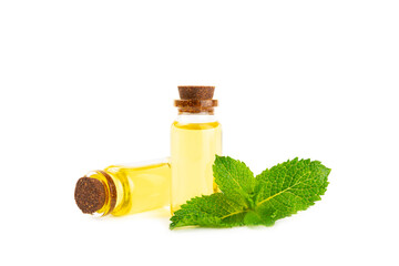 Essential oil mint isolated on white background. Peppermint essential oil with fresh mint leaves. A bottle of aromatherapy oil. Mint extract. The concept of natural cosmetics, spa care