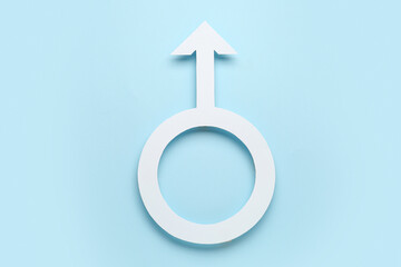 Paper symbol of male on blue background