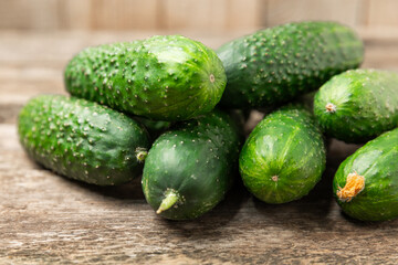 Cucumber on wooden background. Slice of cucumber on background. Fresh organic green cucumbers...
