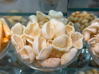 A bowl of white food with a heart shape in the middle