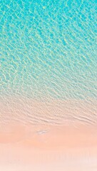 Aerial view of clear turquoise ocean water and pink sand beach for summer vacation vibe