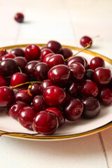 Plate with sweet cherries, closeup