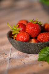 Cup filled with fresh strawberries. Seasonal summer berries, healthy dessert or snack.