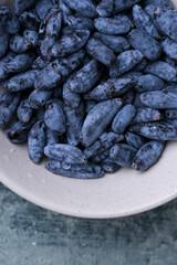 Close-up macro shot of honeysuckle berries. Healthy blue edible berries, rich in antioxidants and vitamins.