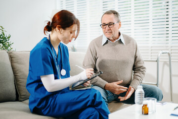 Obraz premium Elderly man receives home healthcare checkup as nurse uses stethoscope with care and professionalism. Medical, support